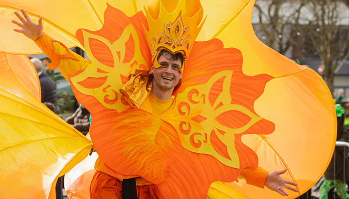 Limerick St. Patrick's Day Parade participant from Clary Costumes in a colourful orange costume