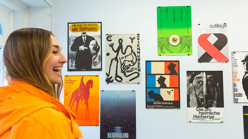 Woman in orange jacket looking at an exhibition at Limerick City Gallery of Art. Photo: Ireland's Content Pool