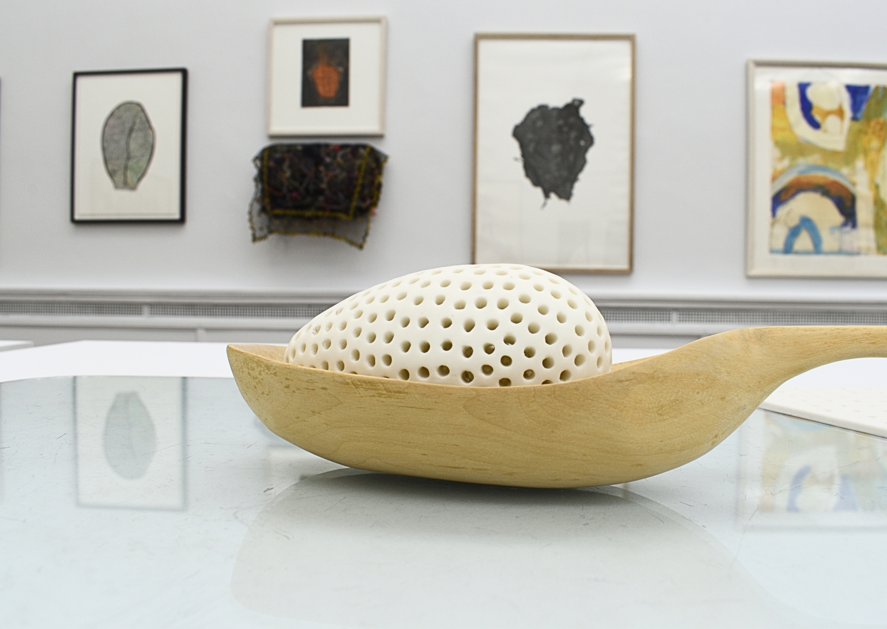 detail of artwork, spoon with ceramic egg - installation image