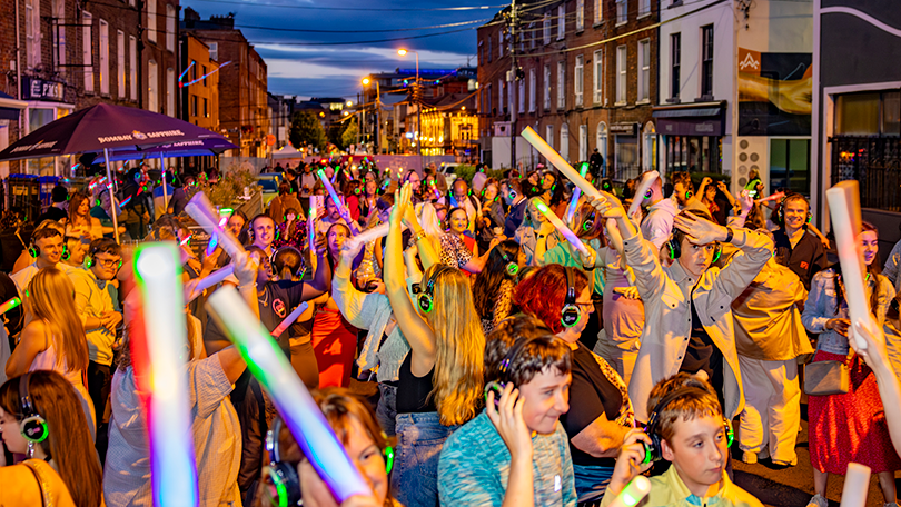 People dancing outside at silent disco Limerick City