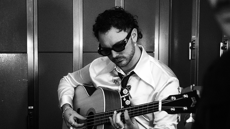 Irish musician Cian Ducrot playing guitar