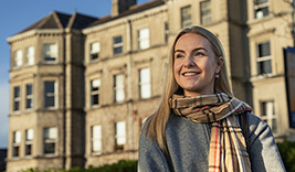 Jennifer, Student at MIC, outside MIC building