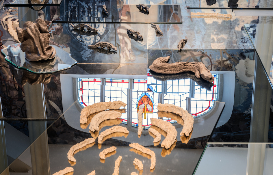 image of objects on glass sheets reflecting building interior