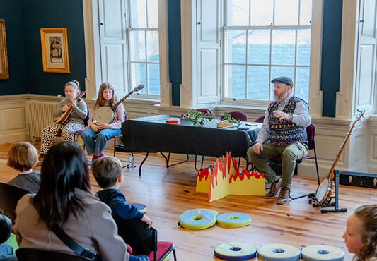 Audience listening to Tales by the Limerick Fireside with Dave Collopy