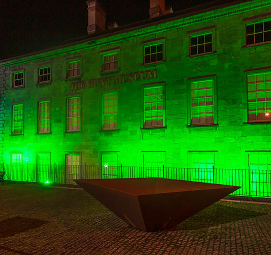 The Hunt Museum lit up green at night for Limerick St. Patricks Festival