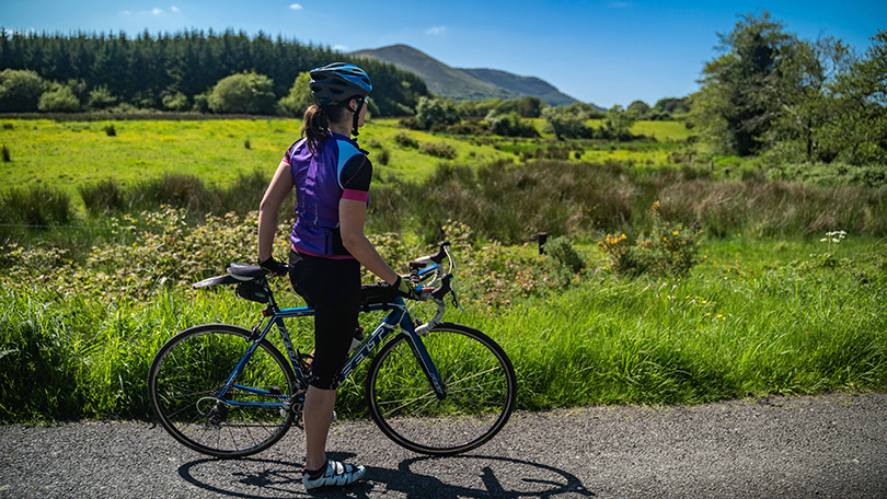 Woman cycling along the Ballyorgan cycling route in County Limerick