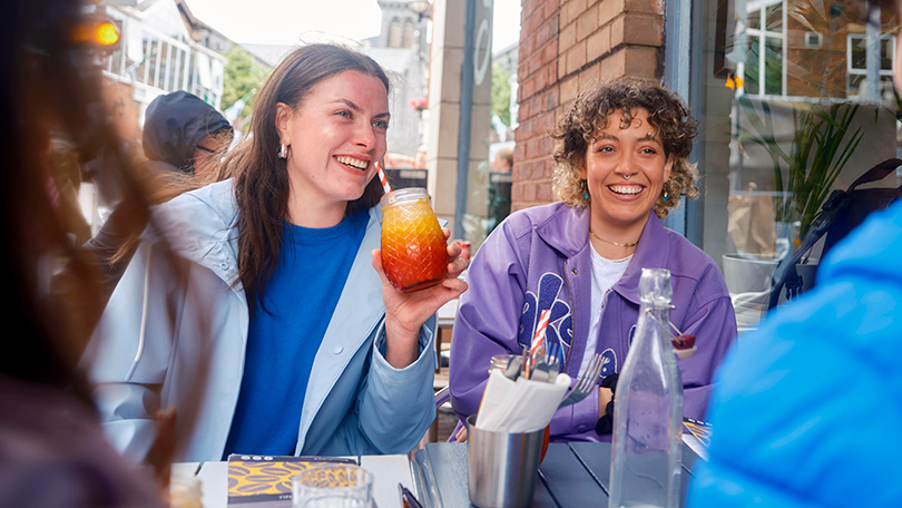 Two women enjoying drinks at Story Café, Limerick City