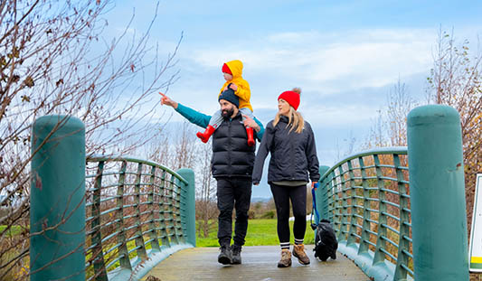 Family walking with their dog at Killeedy Eco Park in Limerick
