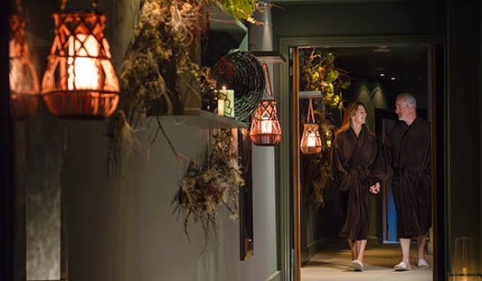 Man and woman dressed in robes at the spa in No. 1 Pery Square in Limerick