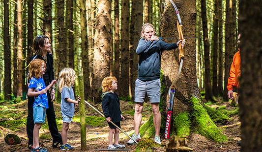 Family doing archery at Basecamp Adventure Park