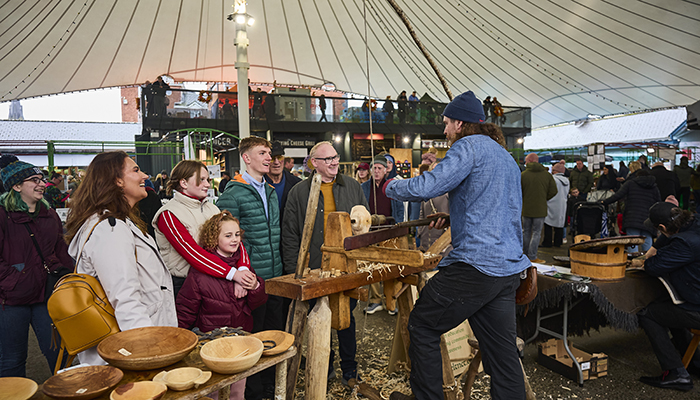 Family speaking with a stall holder at Limerick Milk Market. Photo: Ireland's Content Pool